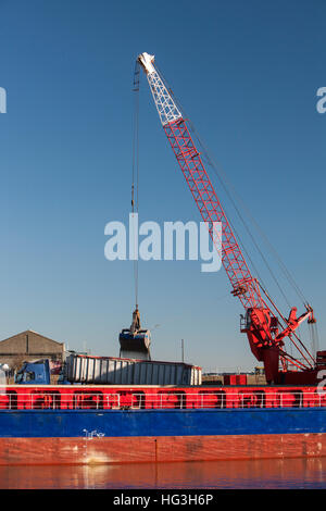 The Esprit cargo vessel off-loading aggregate at the Port of Great Yarmouth. Stock Photo