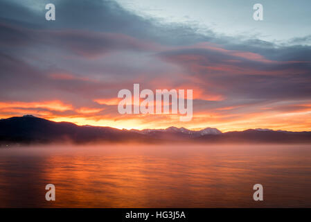 Sun rising behind Shadow Mountain, Colorado with Grand Lake in the ...