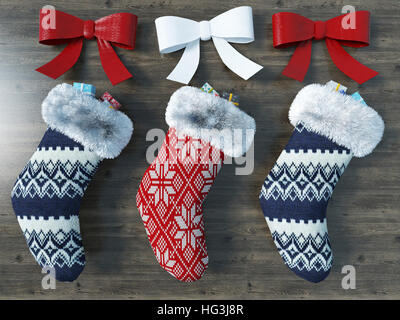 3D render of a beautiful red and blue Christmas socks with ribbons Stock Photo