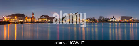 Cardiff Bay at night - Wales Millennium Centre, Pierhead building, Y Senedd (Welsh Assembly Building) and Norwegian Church in early evening, Cardiff B Stock Photo