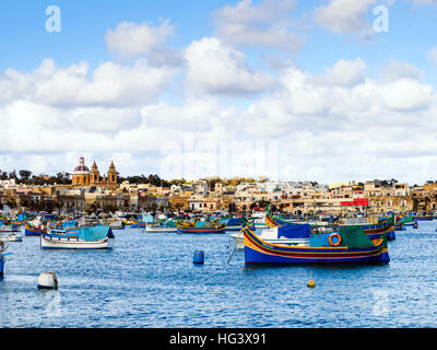 Luzzu traditional Maltese fishing boat - Marsaxlokk harbour, Malta Stock Photo