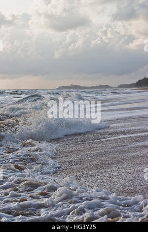 Waves and wind, the rain and the morning sunrise Stock Photo