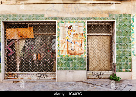 A derelict traditional storefront in the old town of Valencia, Spain. Stock Photo