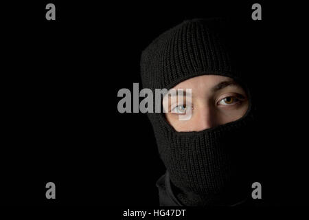 Teen thug with face hidden Stock Photo - Alamy