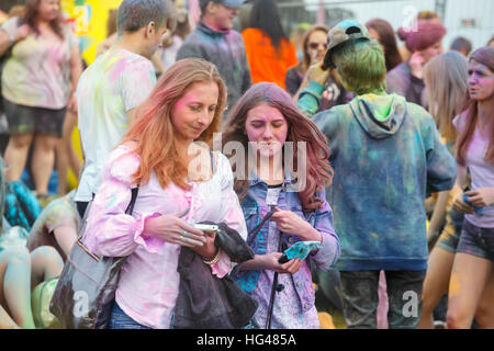 Krakow, Poland, 11 June, 2016: Festival of Colors in Krakow. Unidentified people dancing and celebrating during the color throw, Poland Stock Photo