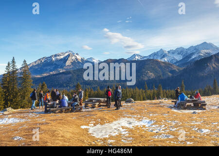 Tatra Mountains, Poland - January 30, 2016: Tourists strolling on a sunny day  in Tatra Mountains, Poland Stock Photo