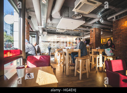 London, people on the table drinking a coffee inside the Pret a Manager coffee bar Stock Photo