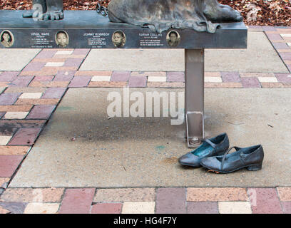 Base of 'Four Spirits' sculpture showing empty shoes below the memorial in Kelly Ingram Park, Birmingham, Alabama, USA Stock Photo