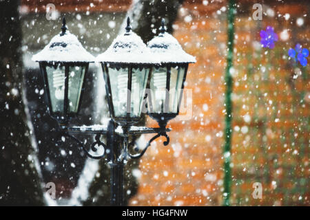 Street lamps in snowfall close up photo Stock Photo