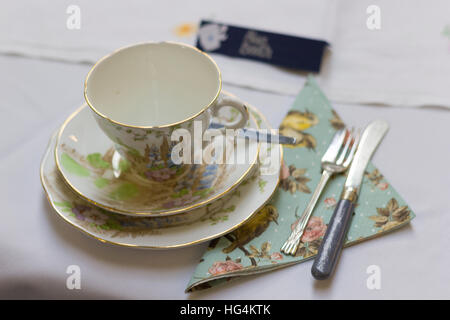 Afternoon tea place setting at shabby chic vintage themed wedding celebration Stock Photo