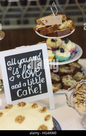 Afternoon tea celebration wedding buffet on blue and white porcelain including handwritten blackboard sign Stock Photo