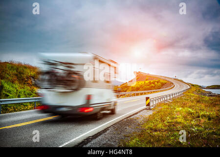 Caravan car travels on the highway. Caravan Car in motion blur. Norway. Atlantic Ocean Road or the Atlantic Road (Atlanterhavsveien) been awarded the Stock Photo