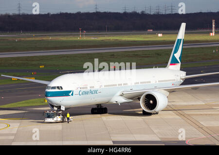 Cathay Pacific Boeing 777-367(ER) airliner on the tarmac of Dusseldorf Airport. Stock Photo