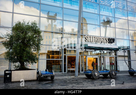 Reflection of the historic Corn Exchange in the modern building that houses Selfridges store in Manchester. Stock Photo