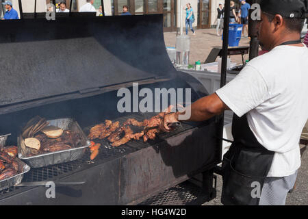 Man grilling barbecue beef - USA Stock Photo