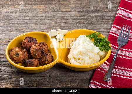 Meat patties with mashed potatoes on the table in natural light Stock Photo