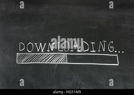Downloading handwritten with white chalk on a blackboard and drawing download bar Stock Photo