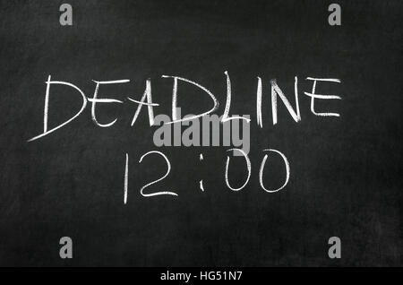 Deadline and time writed on blackboard with chalk Stock Photo