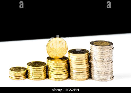 Stacks chart of gold coins isolated on white background Stock Photo - Alamy