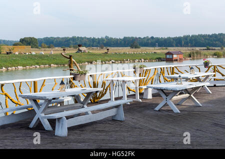 Outdoor furniture placed in the terrace by the lake Stock Photo