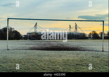 Preston’s Deepdale Football stadium framed by the goalposts of a public pitch in Moor Park. Stock Photo