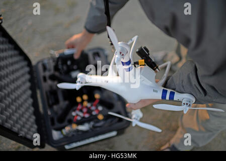 Young man flying Phantom Drone outdoors Stock Photo