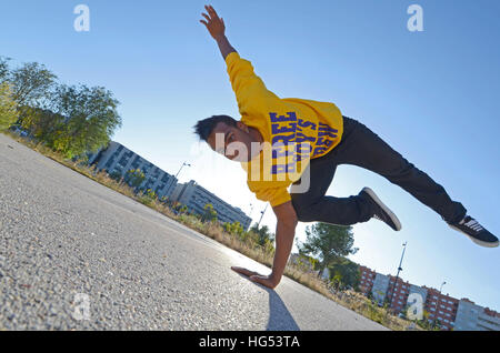 Breakdancer John Lartey performs in the street Stock Photo