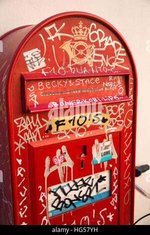 Denmark, Copenhagen, Furtunestraede, graffiti covered post box Stock Photo