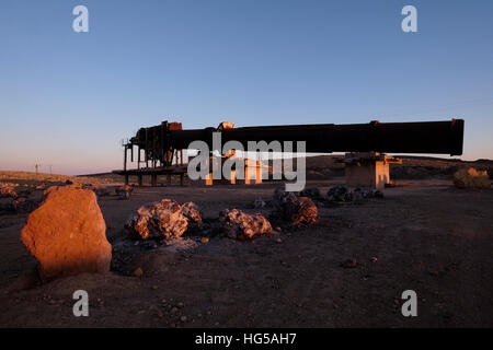 Side view of the old “soil dryer “, for firing rock-like clay, which is petrified laterite, formed about 180 million years ago, at the beginning of the Jurassic period. (The clay was fired on the spot and transported for the fire bricks industry) located in the Harsit abandoned  clay quarry in Makhtesh Ramon Crater in the Negev desert southern Israel Stock Photo