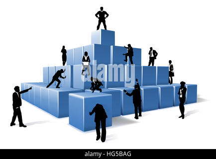 A business team of people silhouettes working together using big building blocks to make a structure. Concept for teamwork Stock Photo