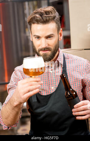 Brewer expertising beer Stock Photo