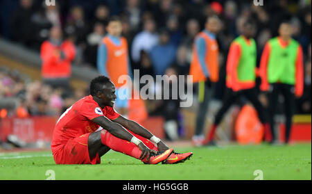Liverpool's Sadio Mane goes down on the pitch Stock Photo