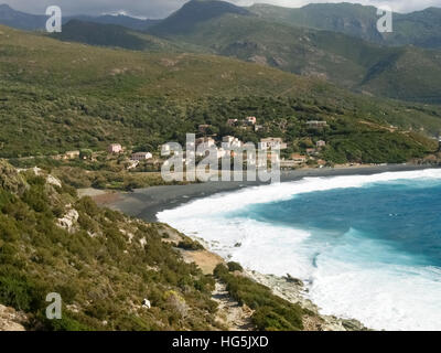 Corsica, France: Coast of Cap Corse and Nonza Beach in rough seas and strong Mistral wind Stock Photo