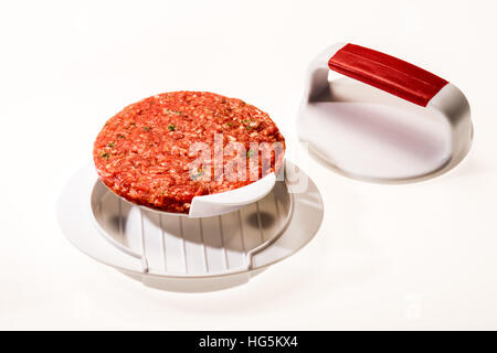 Make Perfect Hamburger Patties Patty Meat. Fastfood, raw beef, hambureger, press, accessories press, stamp, fresh round uniform, Stock Photo