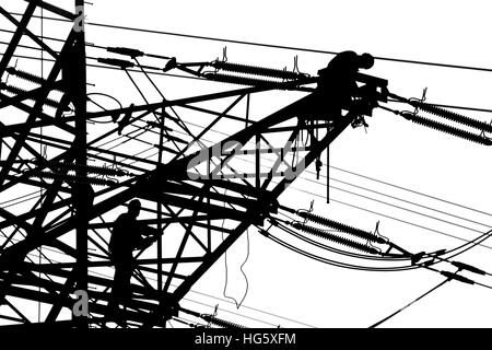 Workers on a transmission tower Stock Photo