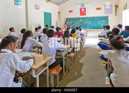 Students attending class, teacher instructing English lesson.