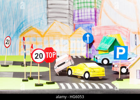 Road accident of two paper cars in the toy city Stock Photo