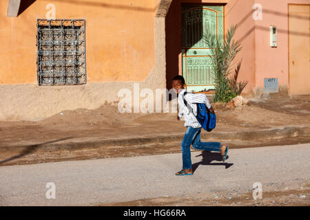 Elkhorbat, Morocco.  Boy Hurrying to School. Stock Photo
