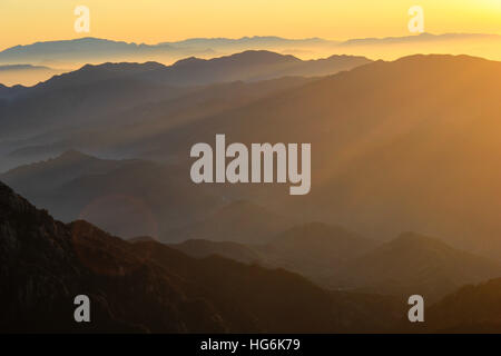 Huangshan, Huangshan, China. 5th Jan, 2017. Huangshan, CHINA-January 5 2017: (EDITORIAL USE ONLY. CHINA OUT).Sunrise at Mount Huangshan in Huangshan City, east China's Anhui Province, January 5th, 2017. Mount Huangshan, also known as Yellow Mountain, is well known for its scenery, peculiarly-shaped granite peaks, Huangshan pine trees, hot springs, winter snow, and views of the clouds from above. Huangshan is a frequent subject of traditional Chinese paintings and literature, as well as modern photography. It is a UNESCO World Heritage Site, and one of China's major tourist destinations. (C Stock Photo