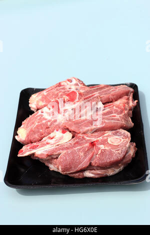 Raw Lamb loin chops in plastic tray - isolated Stock Photo
