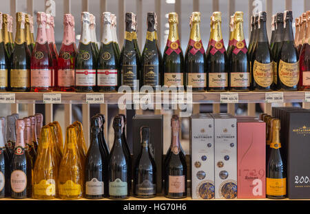 Champagne and sparkling wine from different manufacturers presented on the store shelfs at Kyiv Wine Festival. Stock Photo