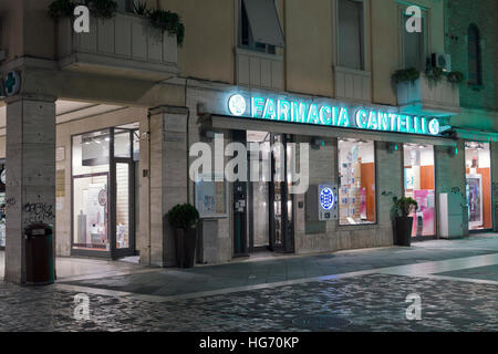 Famous Cantelli Pharmacy display at night on Three Martyrs Square in the city center pedestrian area. Stock Photo