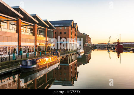 Evening sunlight on Gloucester Quays Outlet shopping centre, beside the Gloucester Sharpness Canal, Gloucester Docks UK Stock Photo