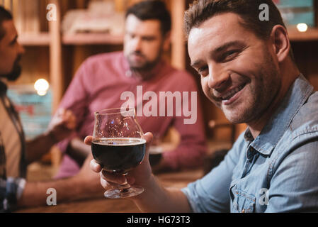 Handsome happy man drinking for you Stock Photo