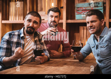 Positive nice men having an evening out Stock Photo
