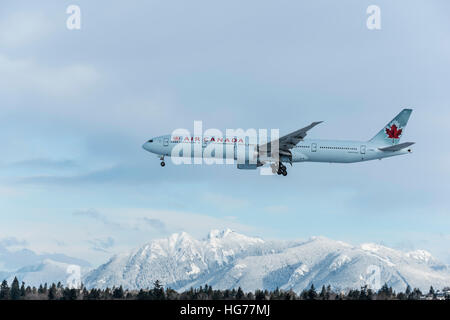 Air Canada Boeing 777-300ER in a descend to land at Vancouver International Airport. Stock Photo