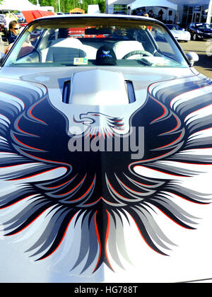 Firebird on hood of antique Pontiac Stock Photo