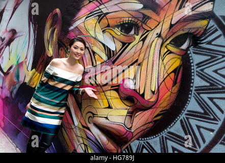 Wall painting by Parisian street artist Alexandre Monteiro aka Hopare of Hong Kong actress and cantopop star Niki Chow (pictured) 'Walls of Change' s Stock Photo