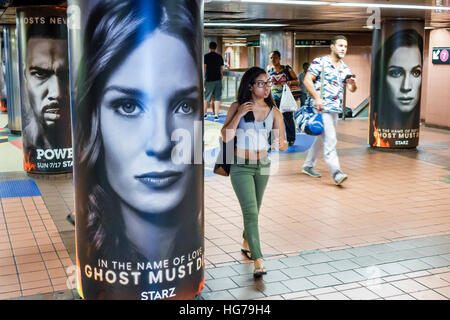 New York City,NY NYC Manhattan,Midtown,Grand Central,42nd Street,station,subway,MTA,ad,Starz,Black Asians,adult adults,woman female women,NY160723038 Stock Photo