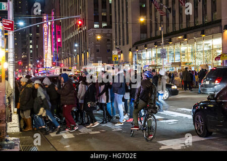 Busy street scene over the Christmas period on 6th Ave, New York. Stock Photo